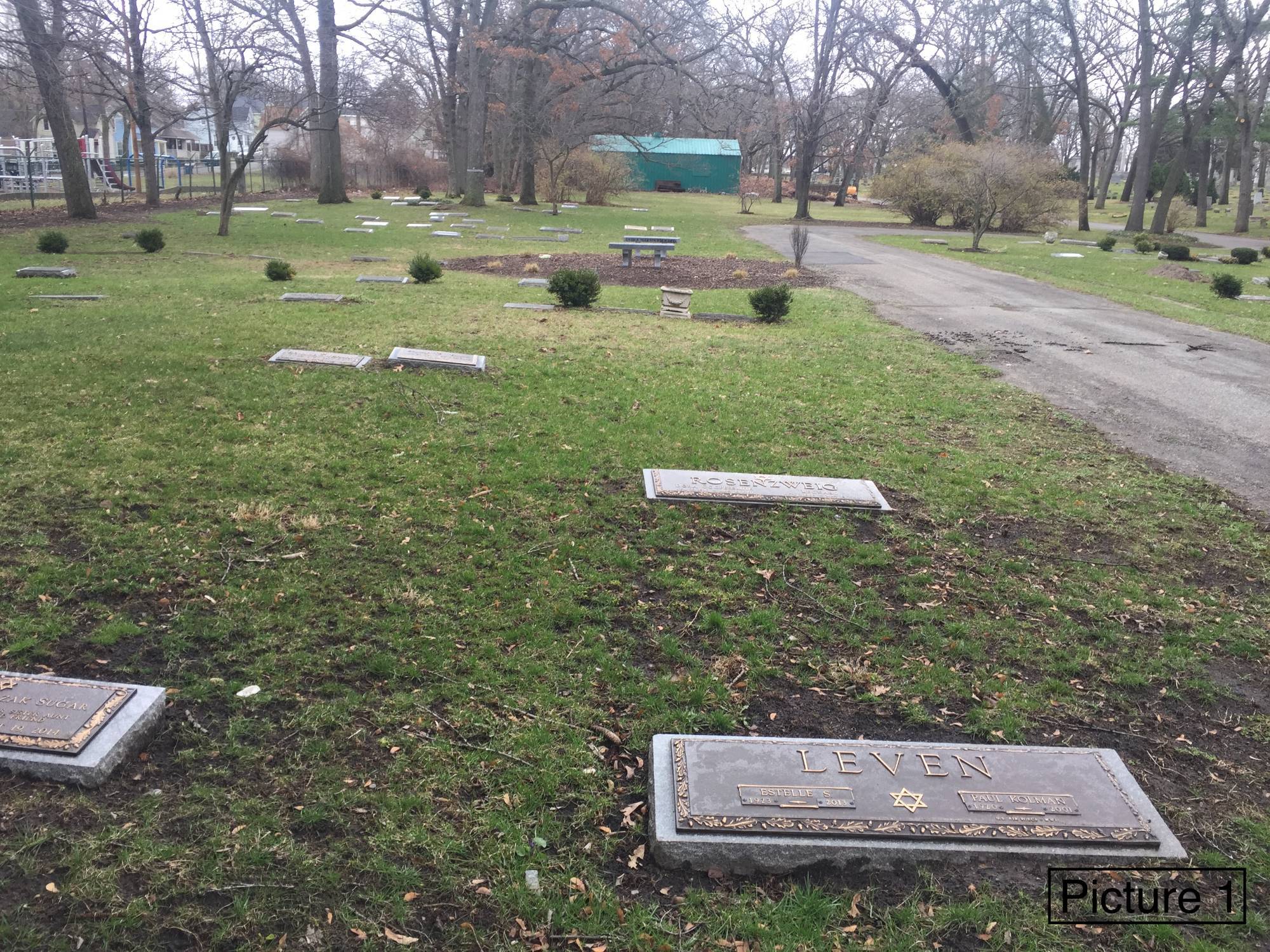 Jewish section of Oakhill Cemetery containing several graves with small flat headstones